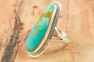 Genuine Manassa Turquoise set in Sterling Silver Ring. This Turquoise is also referred to as King�s Manassa Turquoise. The Manassa Turquoise mine is located in Manassa, Conejos County, Colorado. Created by Navajo Artist Larson Lee. Signed by the artist.